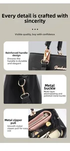 Details of reinforced handles, polished gold hardware, and smooth metal zipper on tote bag
