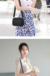 Detail of a black quilted nylon crossbody bag featuring multi-layer zipper compartments