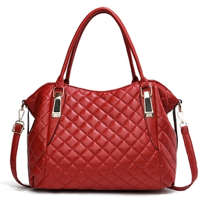Classic red quilted handbag with gold clasp and adjustable strap on white background