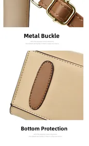 Detail of adjustable gold buckle and reinforced protective base on crossbody bag