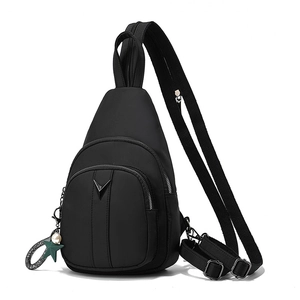 Versatile black nylon chest bag with triangular logo and star charm on white background