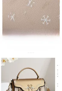 Detailed view of gold leather handbag with diamond swan buckle and textured pattern