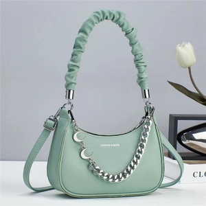 Chic mint green crescent handbag with lychee texture and pleated handle