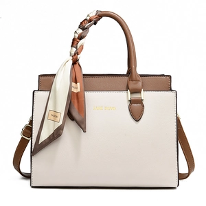 Minimalist beige and brown two-tone tote bag with a decorative silk scarf handle