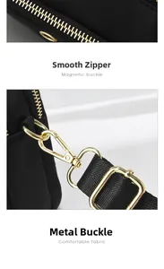 Detailed view of the smooth golden zipper and durable metal hardware on the black crossbody bag