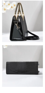 Détails de la texture crocodile et de la poignée tressée du sac à main noir
