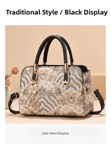 Micro-side view of a black retro handbag with traditional wave embroidery and leaf pendant