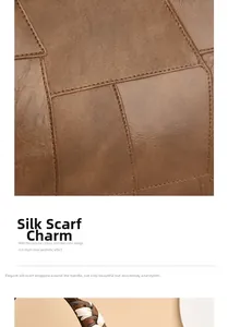 Detail of brown leather handbag featuring stitching and silk scarf wrapped handle