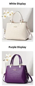 Detail view of white and purple crocodile texture handbags with KUOY logo and strap
