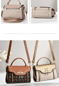 Detail view of textured PU leather handbag with swan metal clasp and pearl tassel charm