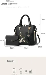 Detailed view of black 2-piece handbag set with floral embroidery and size dimensions