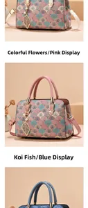 Detail of elegant jacquard handbag with floral pattern and golden leaf pearl pendant
