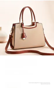Close-up of crocodile textured faux leather handbag with elegant contrast color design