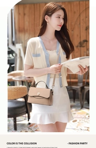 Close-up of light brown pebble leather shoulder bag with golden buckle and knit strap
