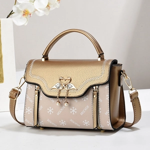 Chic beige crossbody handbag with golden flap and crystal swan emblem for women