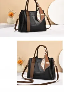 Front view of two-tone tote bag with lychee texture and silk scarf decoration