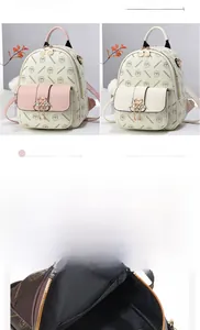Detail view of large capacity faux leather backpack showing internal pockets and four colors
