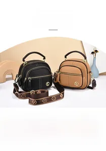 Dual view of vintage crossbody bags in black and camel with textured PU and K logo