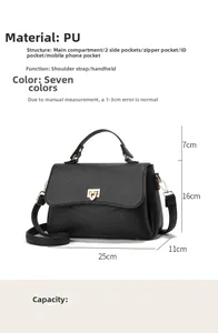 Detail view of black litchi pattern PU leather handbag with adjustable strap and pockets