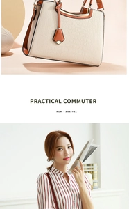 Detail of off-white crocodile embossed tote bag with brown trim and metal handle frame
