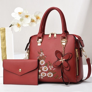 Red leather handbag set with floral embroidery and butterfly pendant for Mother's Day