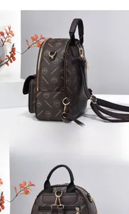 Close-up of the vintage brown monogram backpack with gold-tone hardware and side view detail