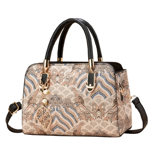Elegant retro jacquard handbag with wave patterns, gold leaf pendant and pearl details