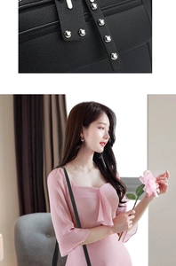Detail of black lychee grain texture and silver metal rivets on a large crossbody handbag