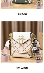Detail of quilted crossbody bag with flamingo buckle, pearl pendant, and cute bear charm