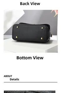 Detailed bottom view of soft leather handbag with four protective gold metal rivets
