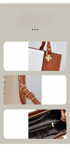 Detailansicht des verstärkten Griffs und polierten Beschläge der braunen PU-Handtasche