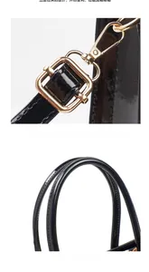 Detailed view of glossy black leather tote with polished gold electroplated hardware hooks
