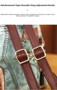 Detail of golden metal buckle on brown faux leather strap with denim blue fabric