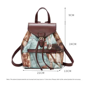 Detail showing dimensions of vintage denim backpack with brown leather handle and flap