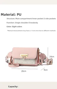 Detail view of pink and white PU leather bag with heart buckle and wide strap dimensions