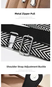 Detail view of silver metal zipper pull and adjustable woven strap on a brown leather bag