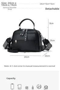 Detailed view of black pebbled leather tote with geometric strap and 24x19x10cm size dimensions
