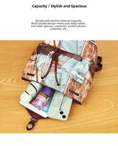 Spacious interior of retro denim print backpack showing tablet, phone, and daily essentials