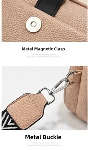 Detail view of lychee leather crossbody bag with silver magnetic snap and swivel hook