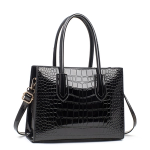 Chic black crocodile embossed patent leather handbag with adjustable crossbody strap