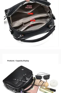 Detailed interior of a black leather handbag showing multi-layer compartments and large capacity