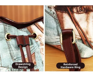 Detail showing the brown leather drawstring and reinforced metal rings on a denim bucket bag