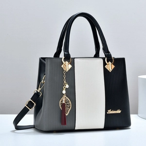 Damen PU Leder Handtasche Farbblock Vertikale Textur Umhängetasche Mit Quastenblatt Anhänger Mode Große Kapazität Umhängetasche