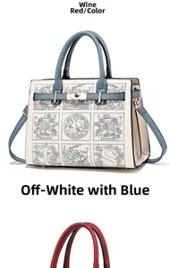 Detail view of the elegant beige and blue patterned handbag with golden twist lock and studs