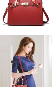 Red leather handbag for women featuring gold hardware and a decorative floral scarf detail