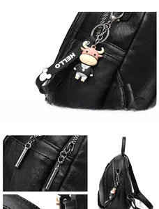 Detail view of black PU leather backpack featuring silver zipper and cute DIY calf charm