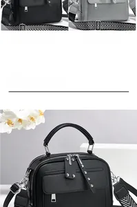 Detail view of lychee grain leather handbags with stylish herringbone patterned wide straps