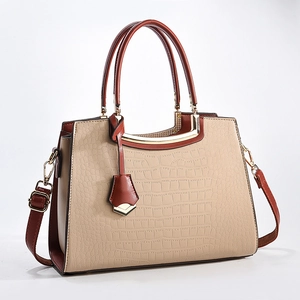 Elegant beige crocodile texture tote bag with brown side panels and gold metal hardware