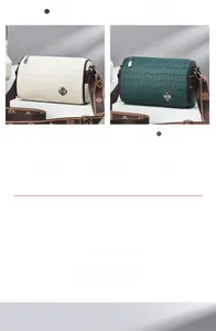 Detail of stone-patterned barrel bags in beige and green with jacquard clover straps