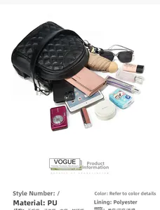 Spacious black quilted backpack interior showing tablet, camera, and daily essentials
